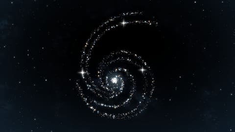 A face-on spiral galaxy on a black background, its arms traced by hundreds of white, blue, and orange points of light, with a few brighter stars twinkling.