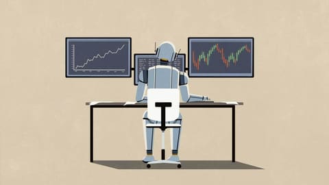 Seen from behind, a gray humanoid robot sits in an office chair, working at a desk in front of three monitors showing a rising line graph, lines of code, and a candlestick stock chart.